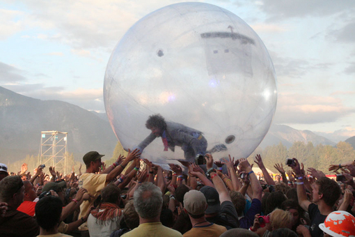 Lead singer Wayne Coyne goes crowd surfing in a big plastic ball